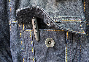 The pen-camera, hidden or spy micro camera in a jacket pocket. Eine geheime Stiftkamera, die in einer Jackentasche versteckt ist.